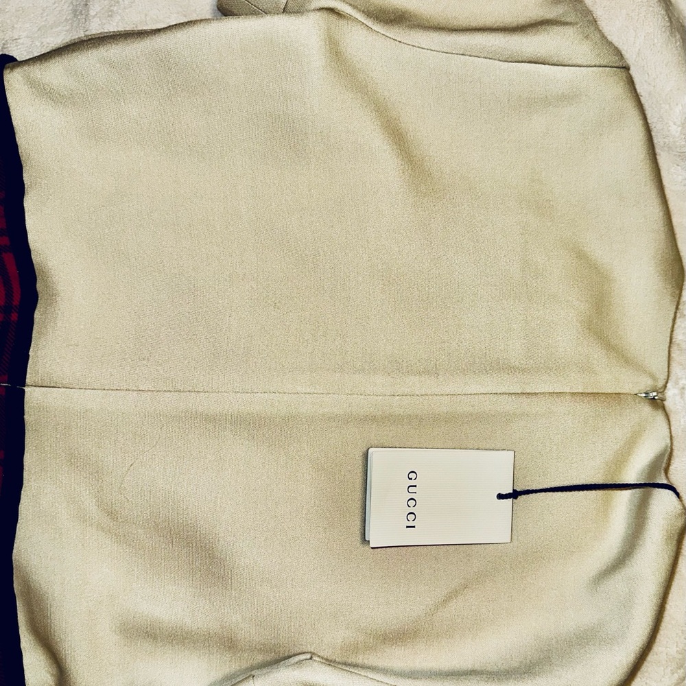 Gucci Red, Crème and Black Asymmetrical Dress with Gucci ivory dress cover. - Picture 10 of 15